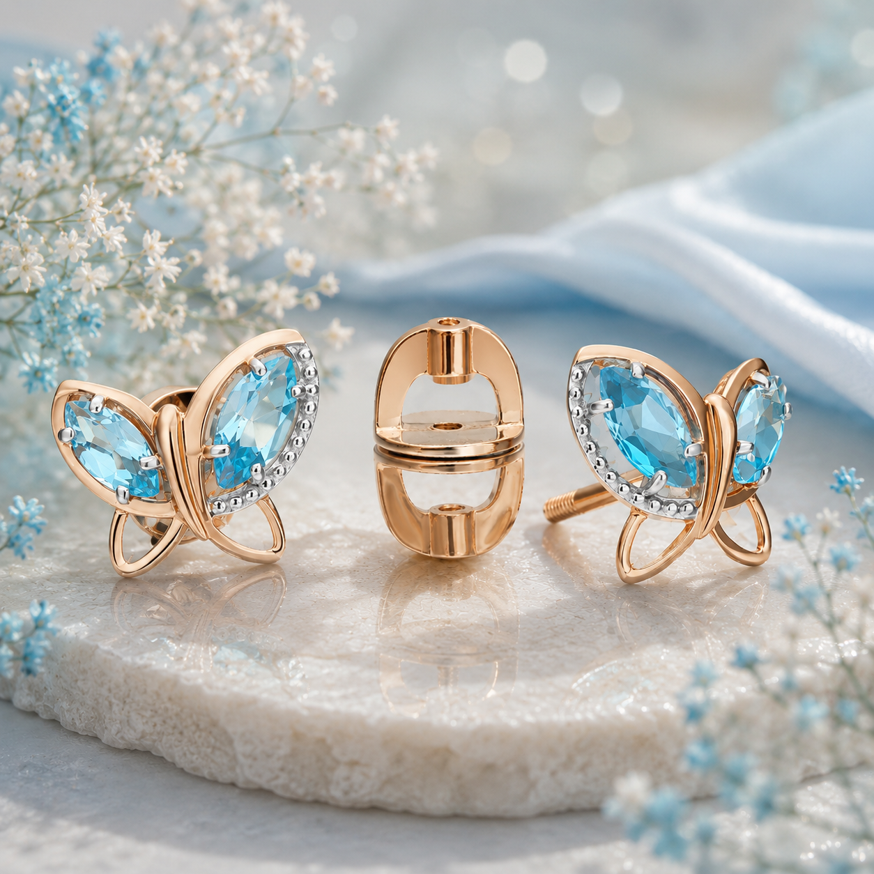 Ohrstecker Schmetterling aus Roségold 585 und Blautopas