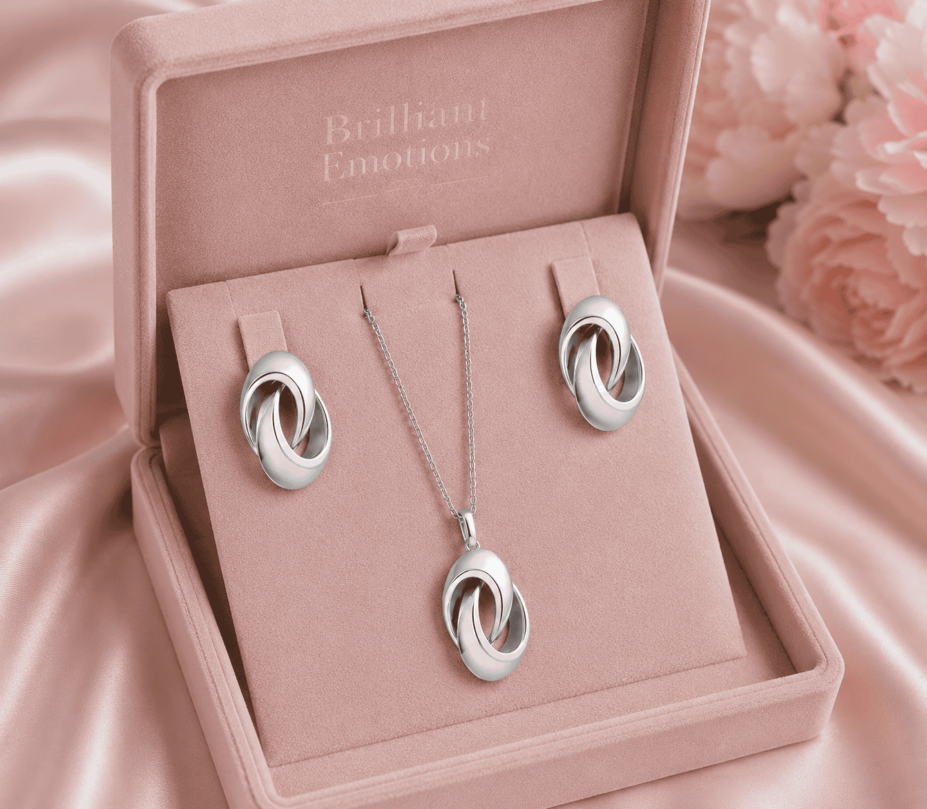 Elegantes Schmuckset mit Halskette und Ohrringen in rosa Schmuckbox.